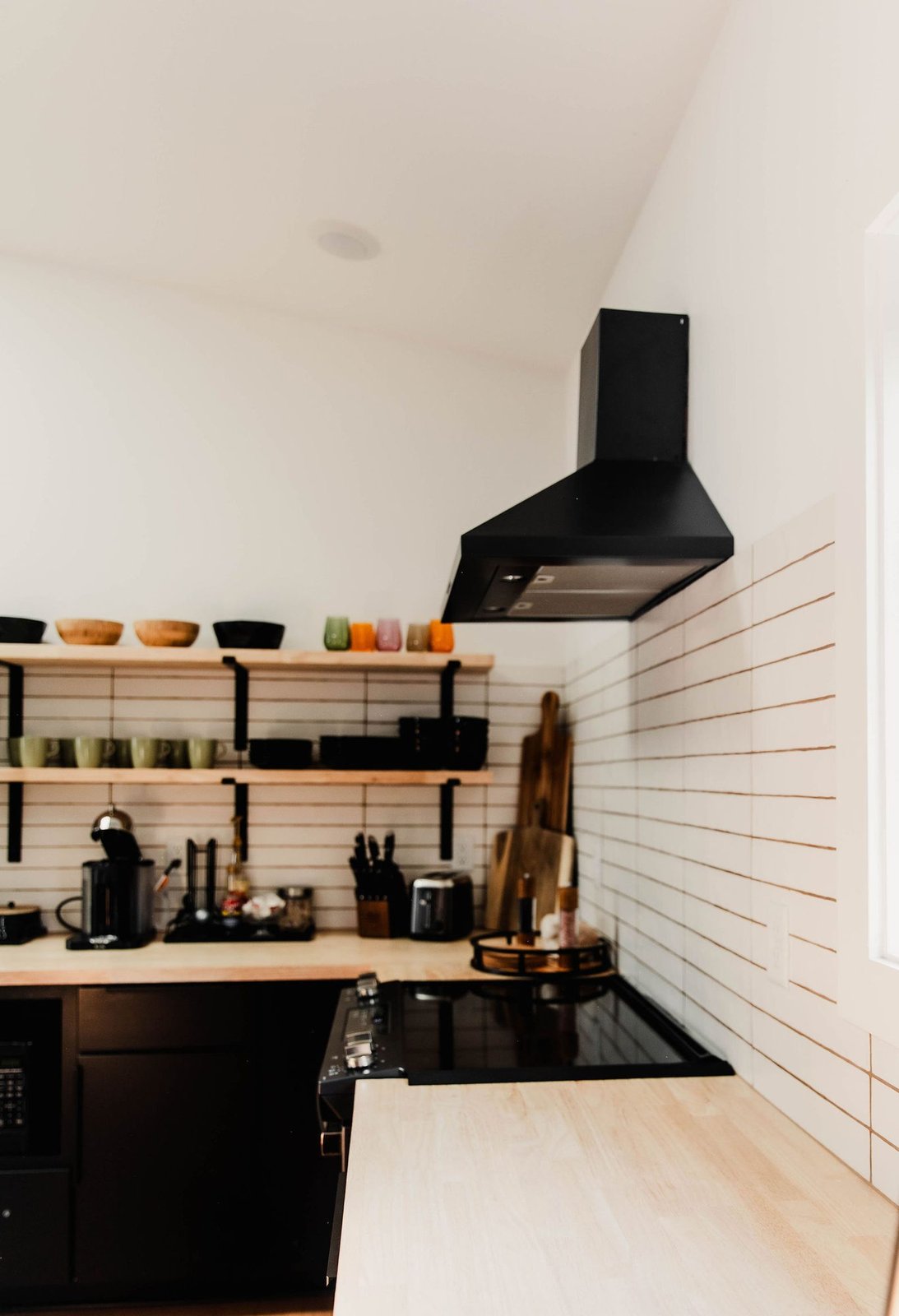 Kitchen with open shelving and range