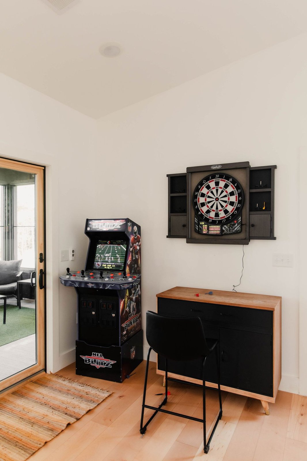 Game room with arcade and darts