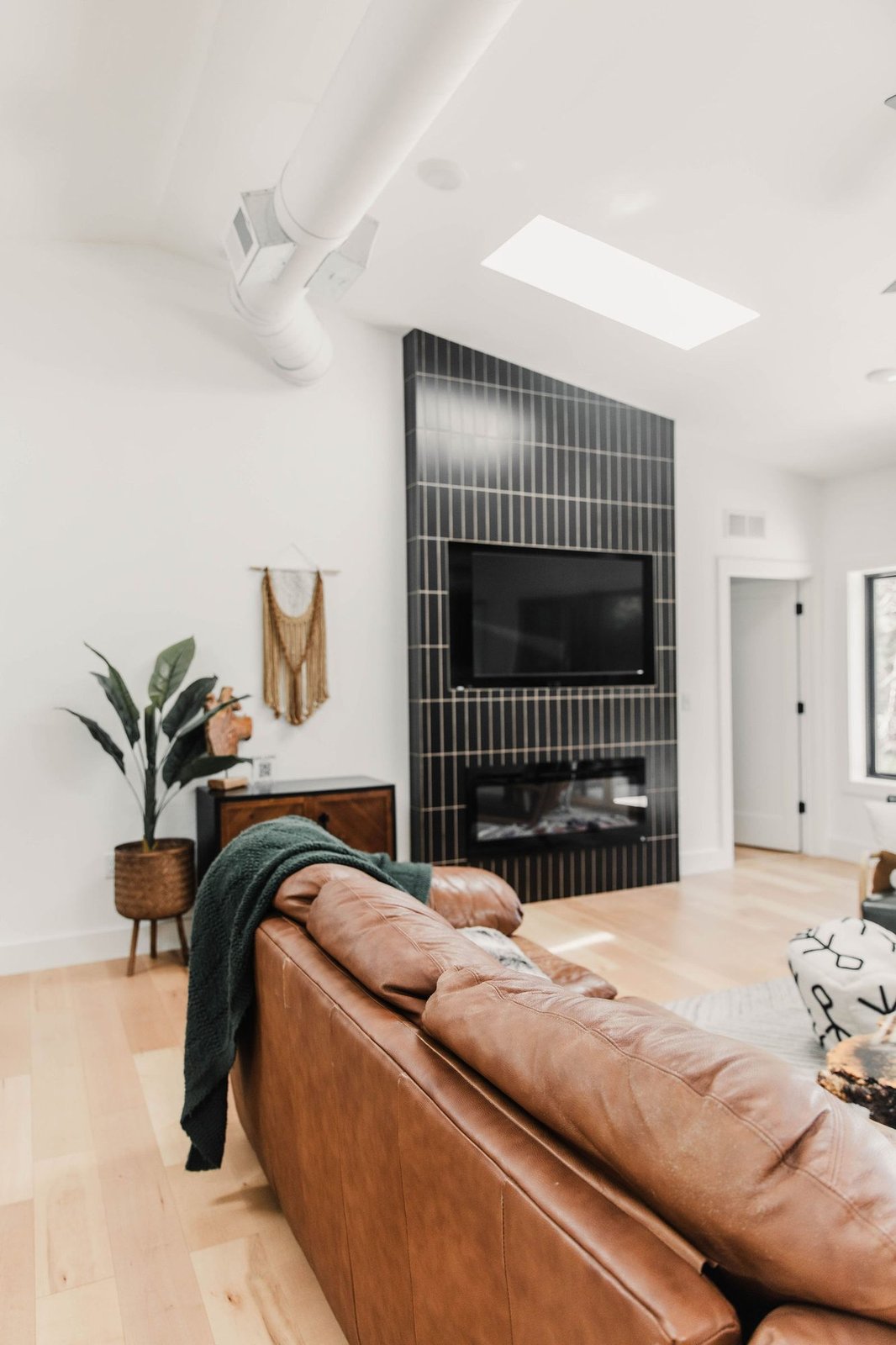 Living room with tiled electric fireplace