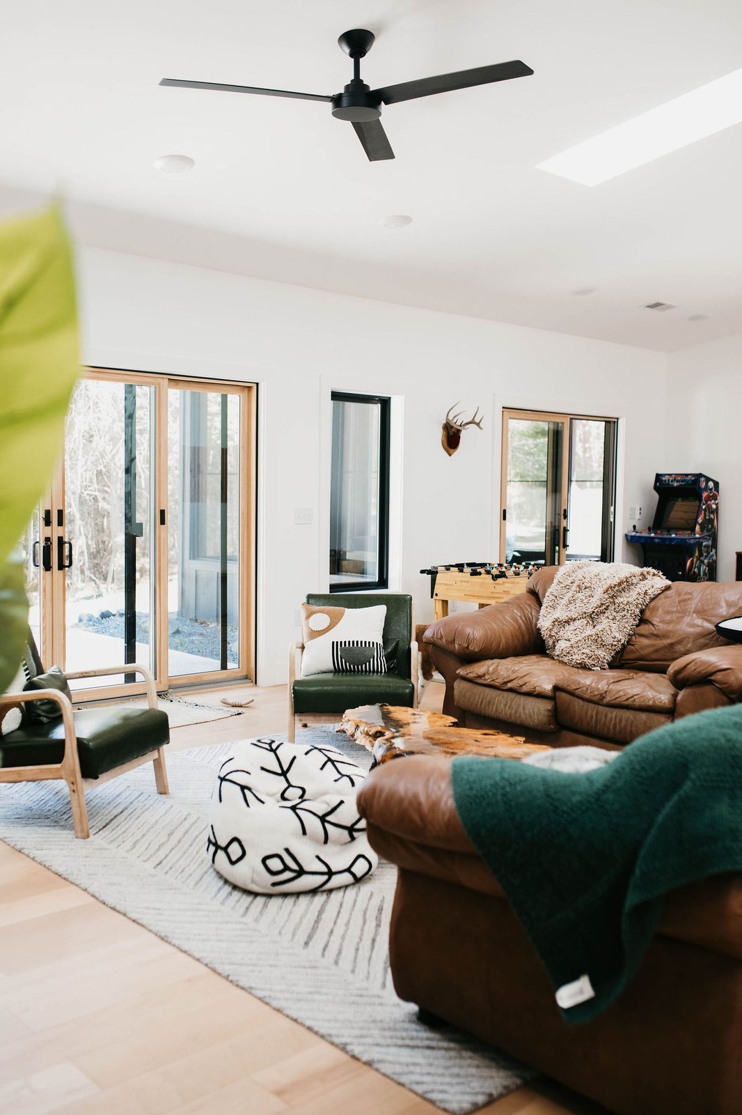 Bright living room with doors to the screened porch