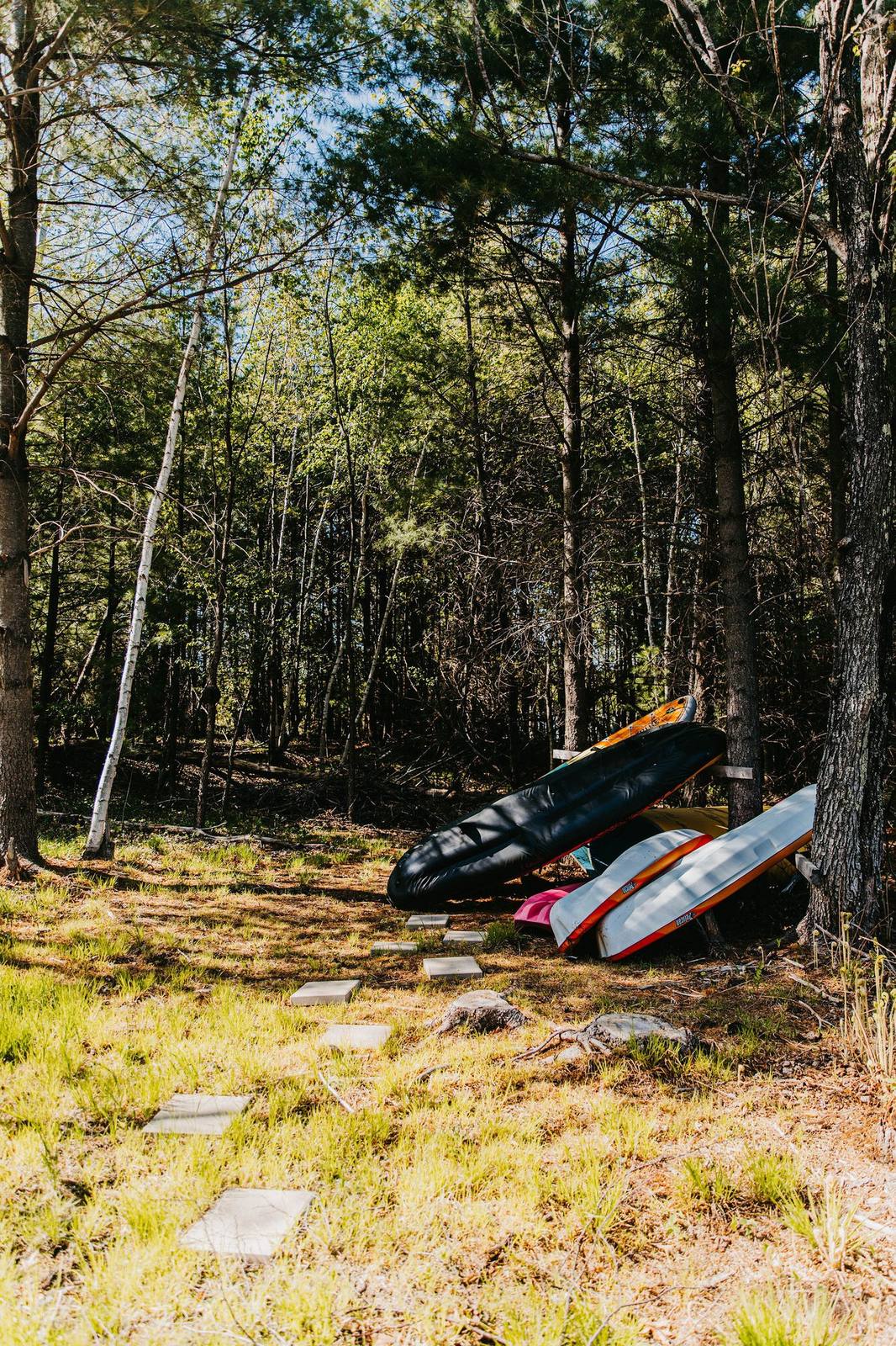 Kayaks and paddleboards by the lake trail